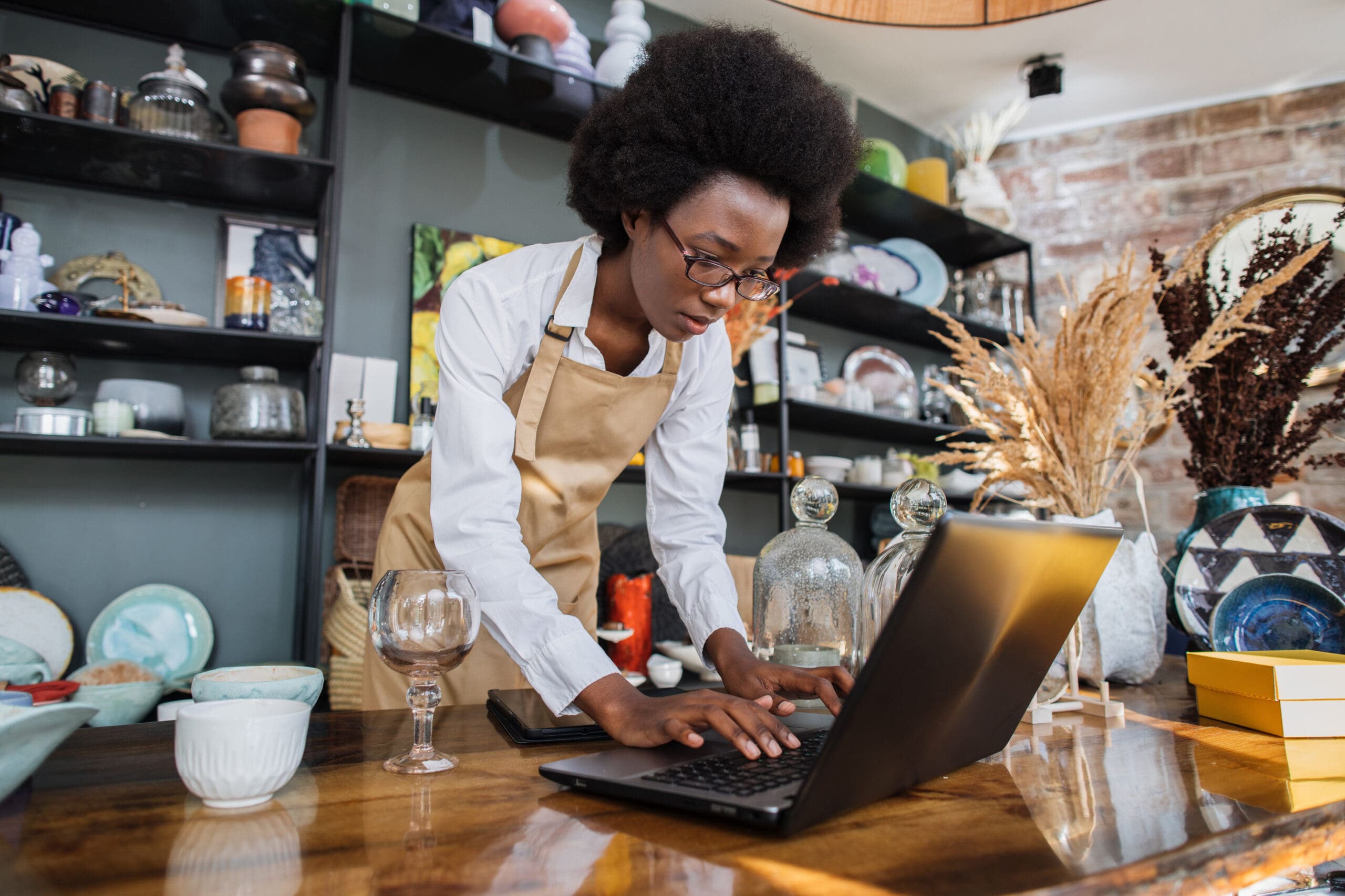 Woman using her laptop in her business