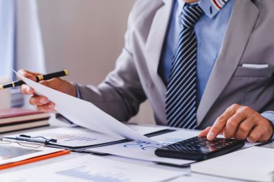 Business man working on the finances for his business.