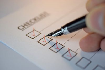 checklist box with red checkmark paper