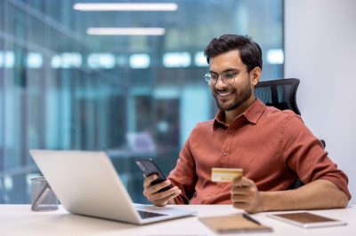Business man using a smart phone for online banking